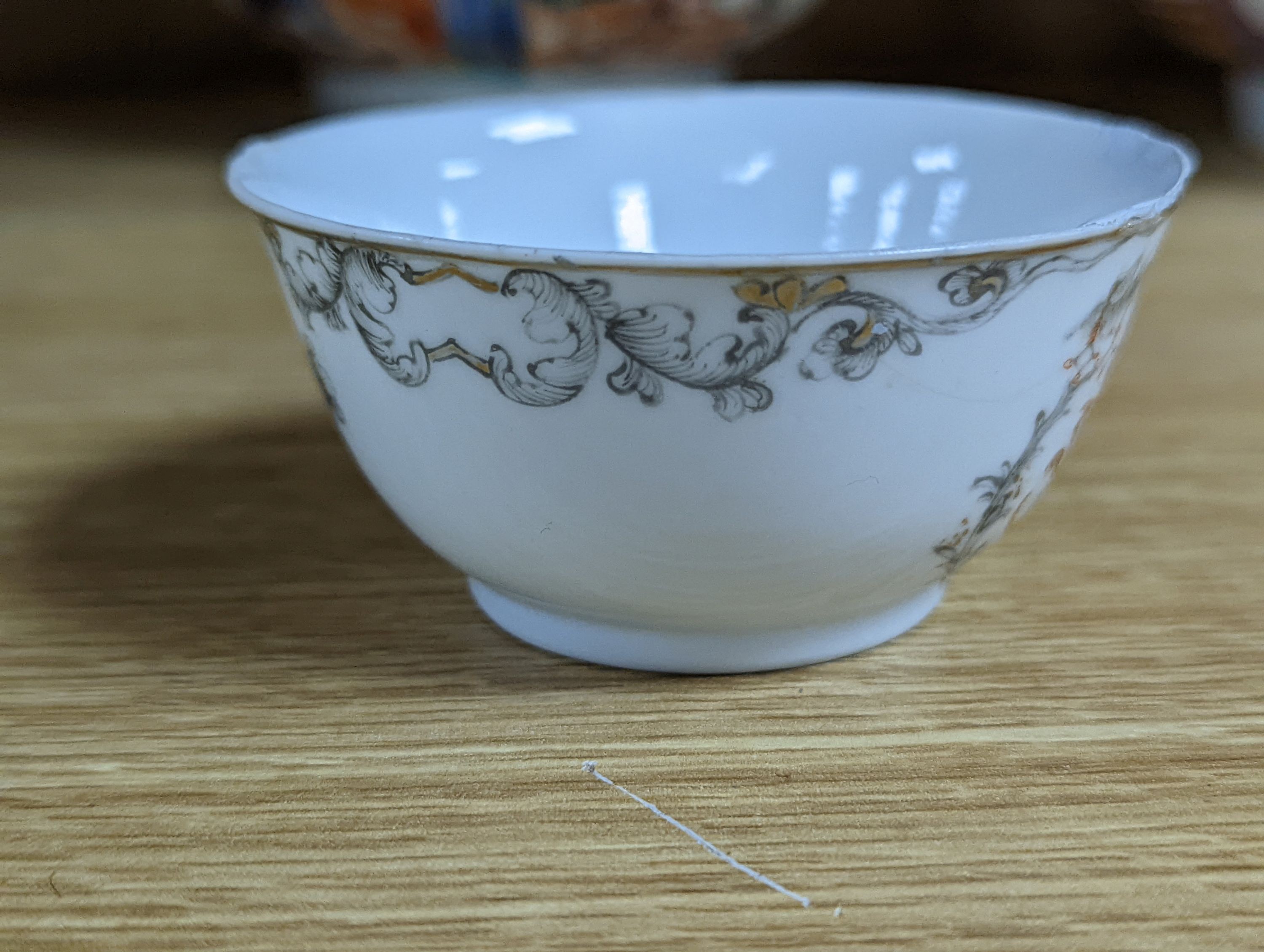 Two 18th century Chinese export bowls, a similar tea bowl and another Chinese blue and white tea bowl, largest 20cm diameter